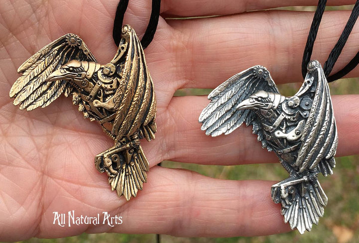 Bronze and silver Raven necklaces carved in wax with watch parts added for an industrial look.