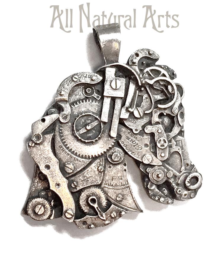 Close up photo of a horse originally created from antique watch parts and cast in Sterling silver with a beautiful hand antiqued patina to bring out the details.
