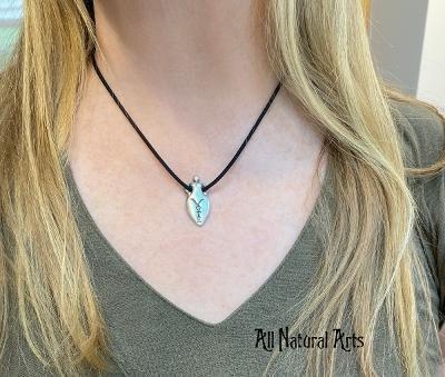 A woman wearing Silver Vote Goddess pendant on black cord - All Natural Arts