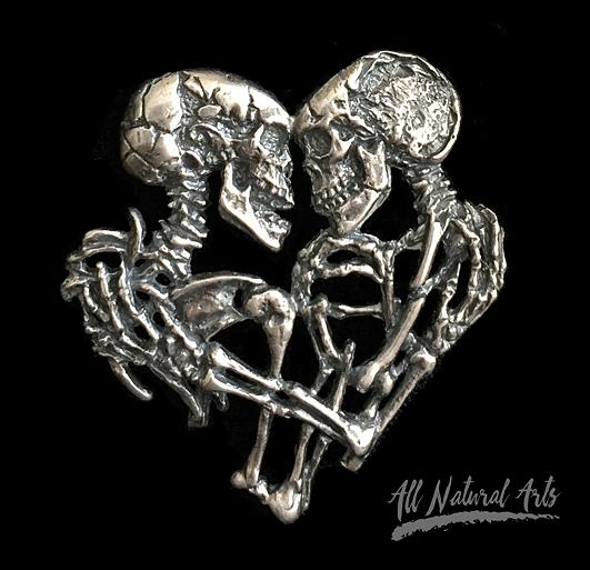 Close up of the Enternal Embrace necklace of a pair of skeletons entwined, By Sue Beatrice