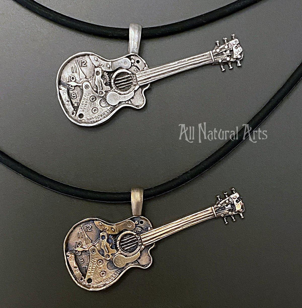 2 watch parts guitar pendants one cast in sterling silver the other bronze.