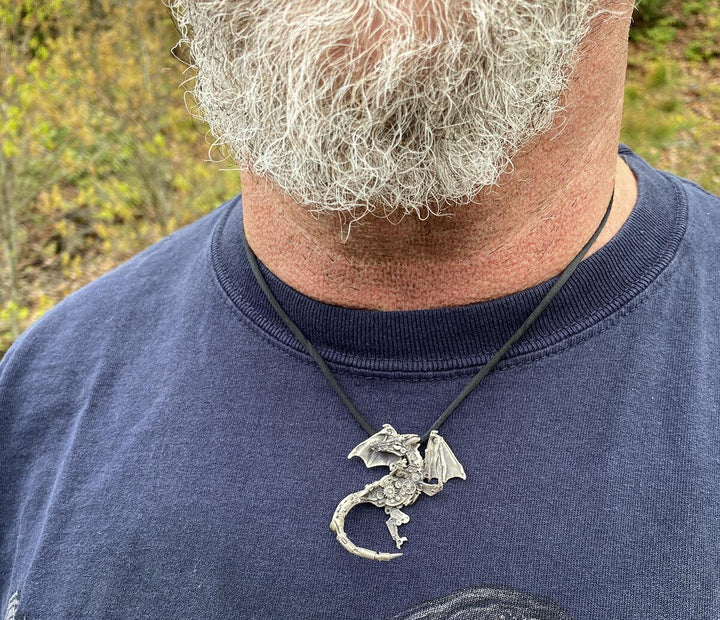 Man with beard wearing silver Finger Dragon Necklace | Mythical jewelry that captivates the imagination.