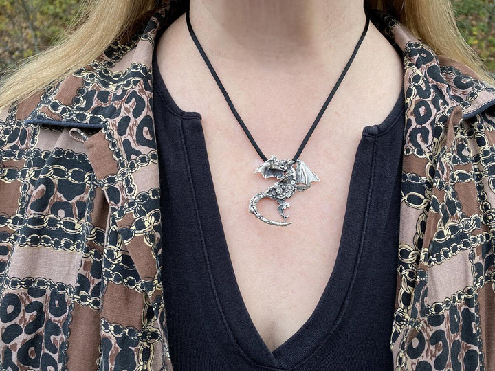 Girl wearing silver Finger Dragon Necklace | Mythical jewelry that captivates the imagination.