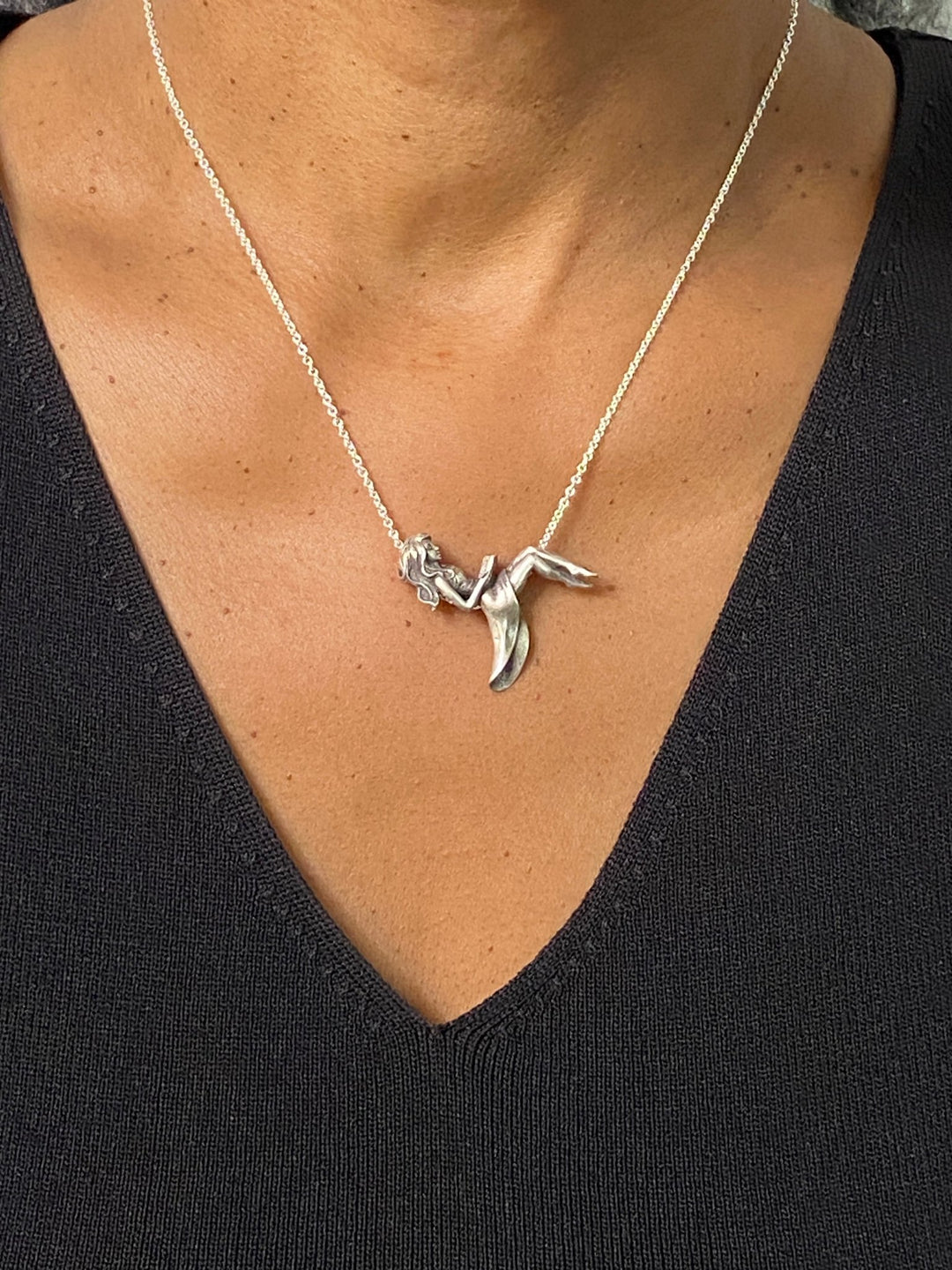 Woman wearing ’The Reader’ Sterling Silver Book Pendant and Necklace - Perfect for Book Lovers!