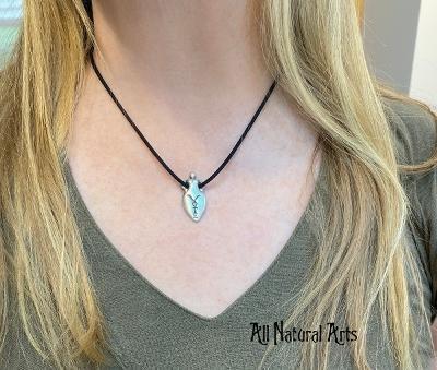 A woman wearing Silver Vote Goddess pendant on black cord - All Natural Arts