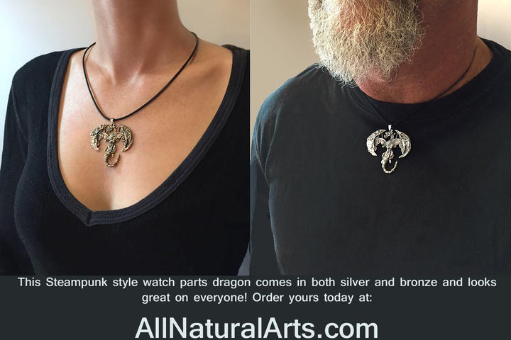 Man and woman wearing Handmade 'Gotham' Dragon Pendant by Sue Beatrice, made from vintage pocket watch parts, exuding antique elegance and cast in sterling silver and silicon bronze
